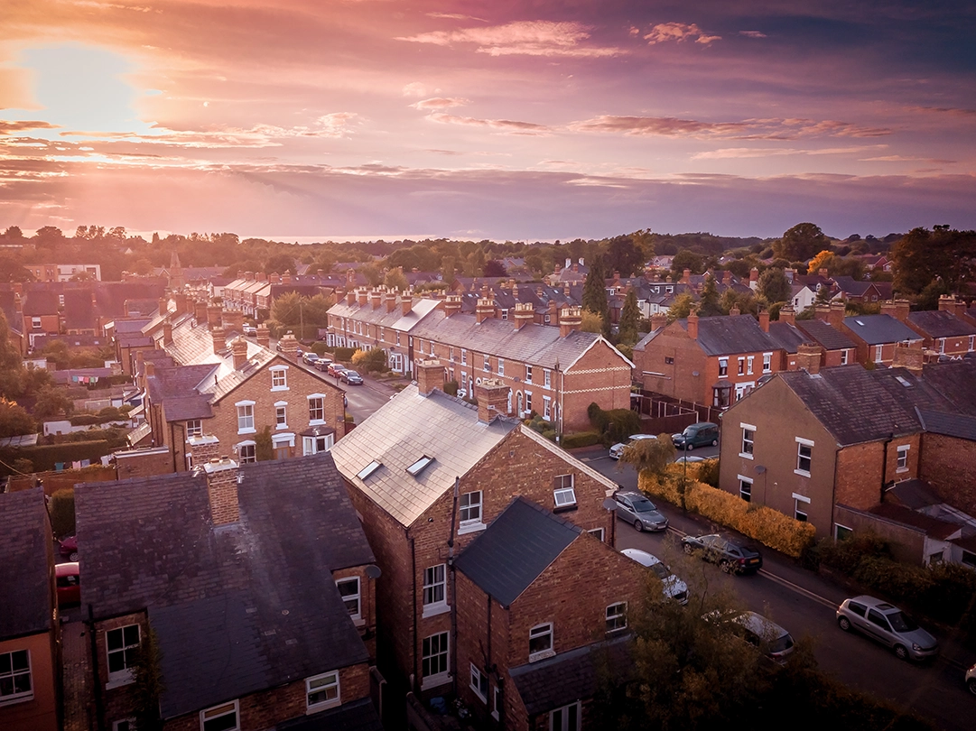 aerial view of houses with sunset