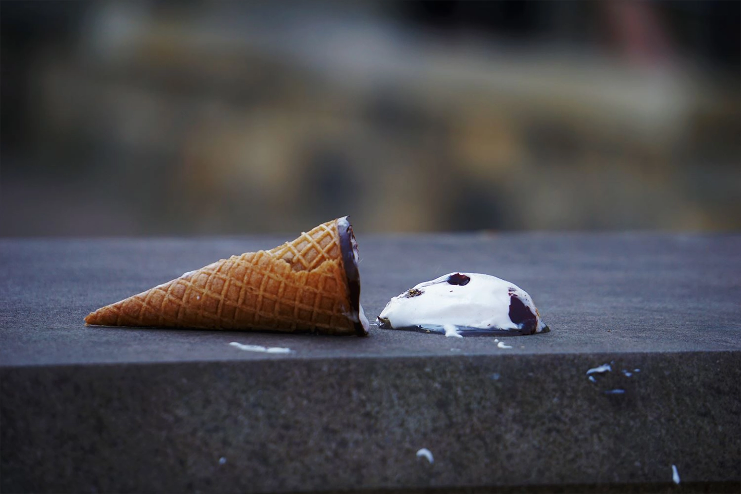 ice cream cone tipped on its side ice cream melting