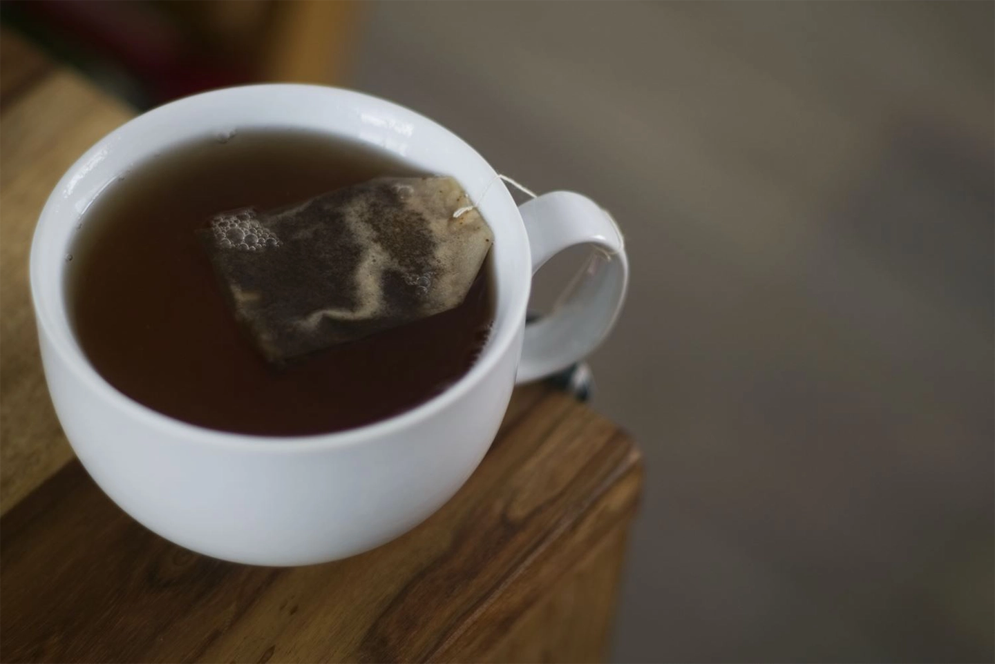 cup of tea with a teabag in it on a table