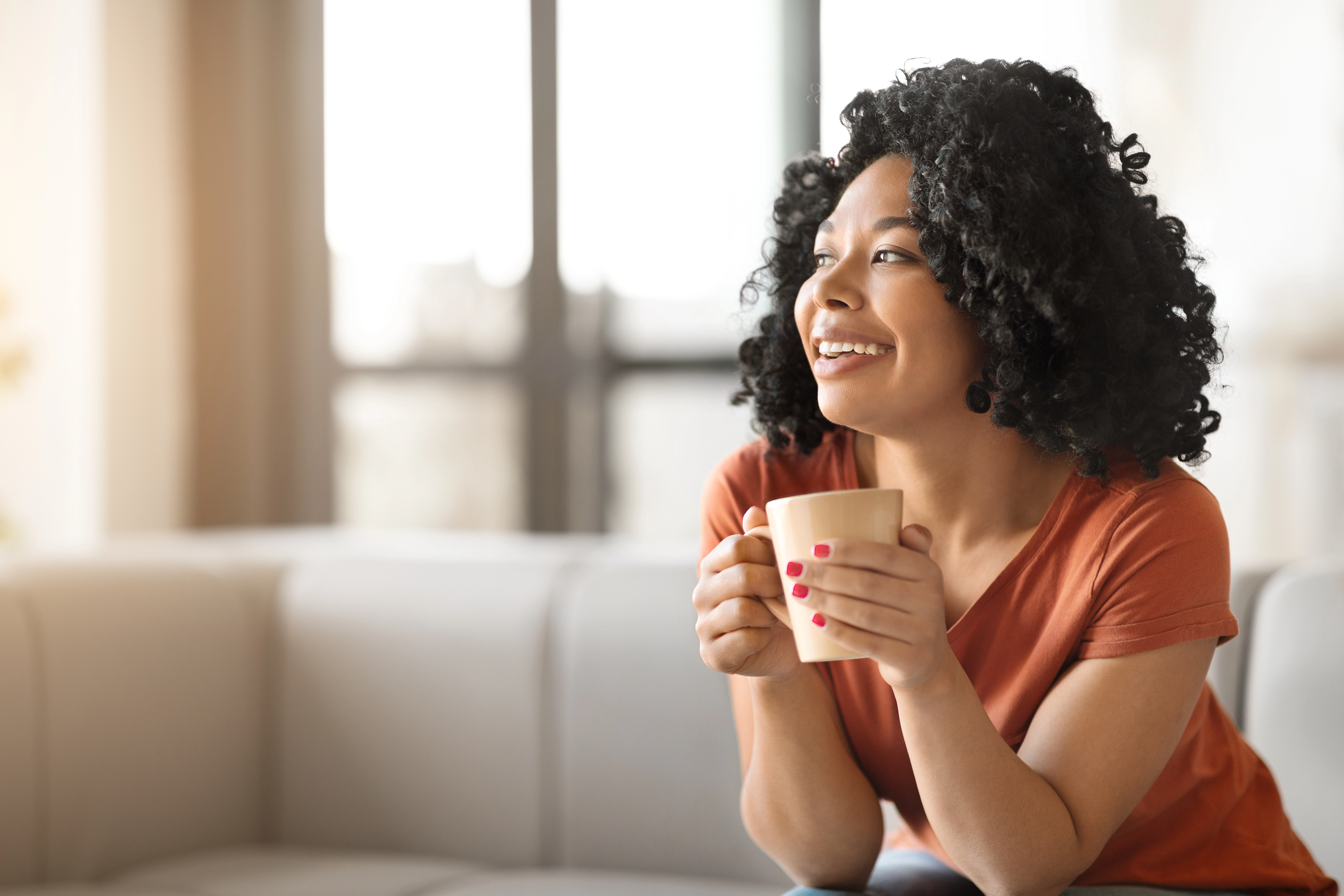 woman enjoying coffee at home